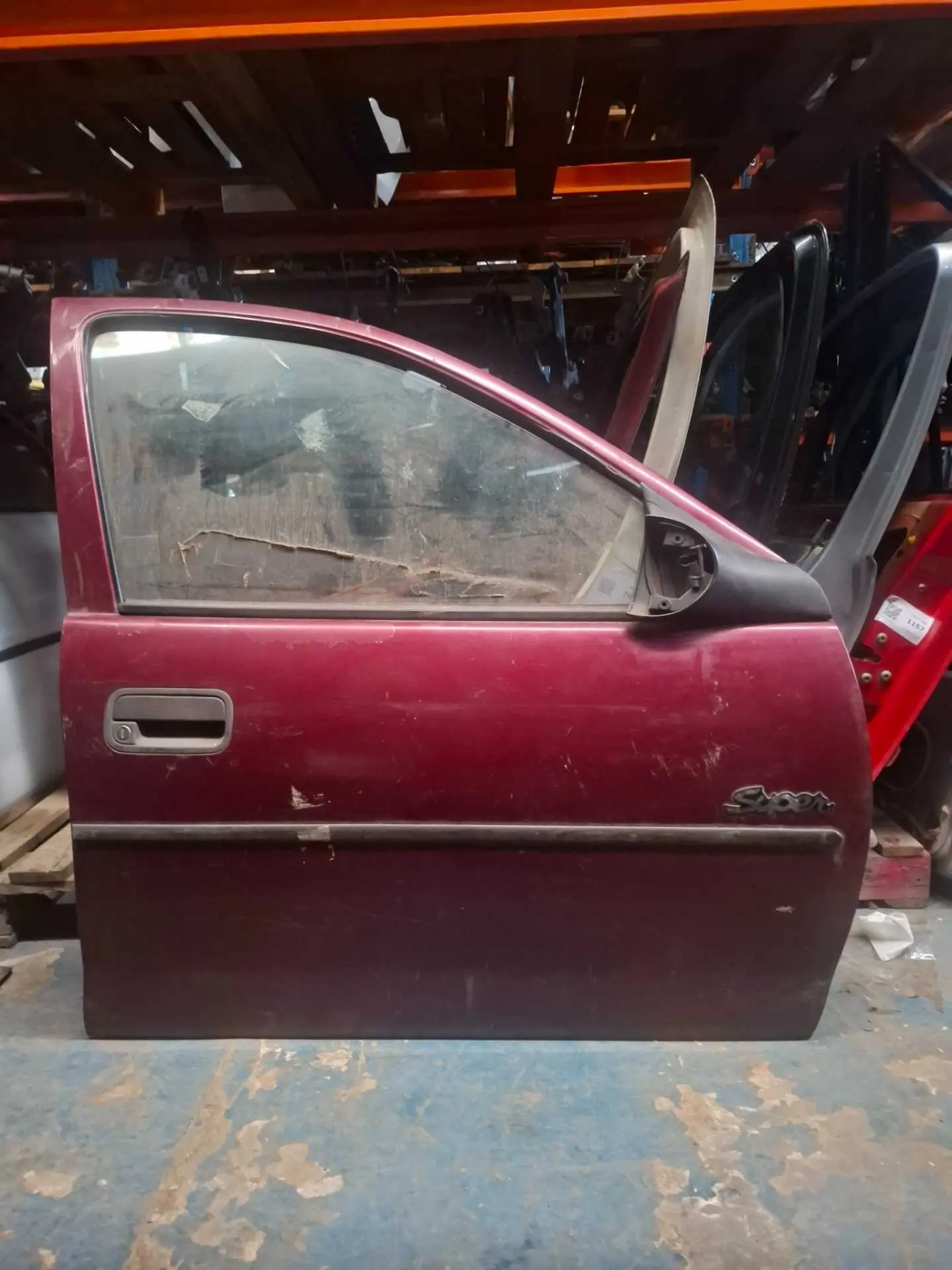 PORTA CORSA dianteira DIREITA BORDO RISCADA